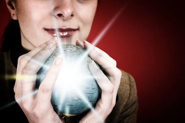 Globe in a girl's hands — Stock Photo, Image