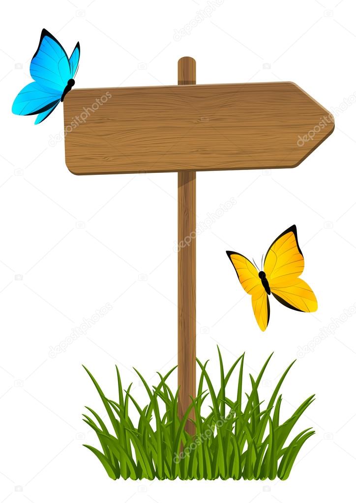 Wooden signpost with green grass