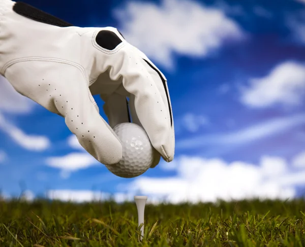 Hand and golf ball — Stock Photo, Image