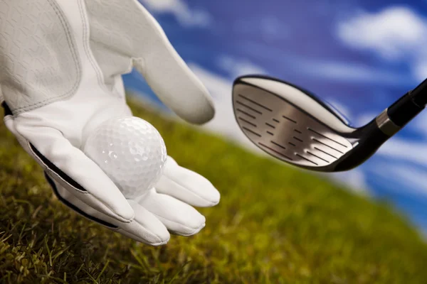 Hand och golf ball — Stockfoto