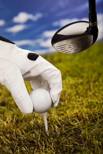 Hand och golf ball — Stockfoto