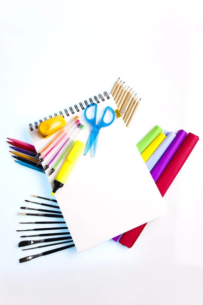 Notepad with school supplies — Stock Photo, Image