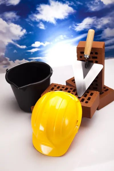 Brick, yellow hard hat, tools — Stock Photo, Image