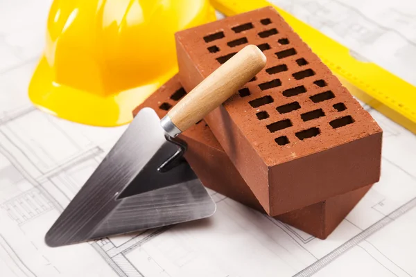 Construction tool, Brick background — Stock Photo, Image