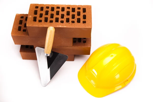 Construction tool, Brick background — Stock Photo, Image