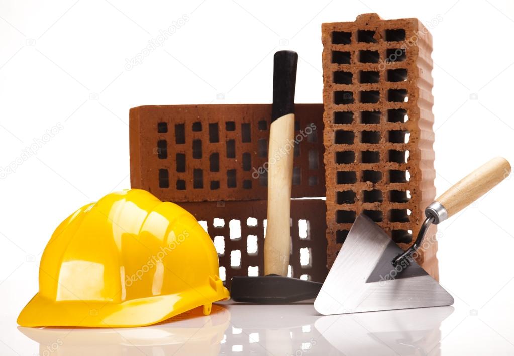 Building background, trowel and bricks