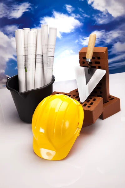 Construction plans and blueprints, bricks — Stock Photo, Image