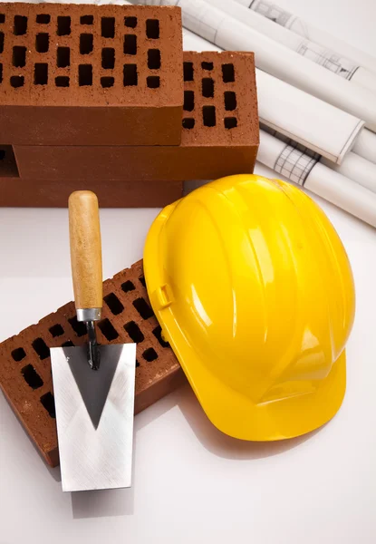 Construction plans and blueprints, bricks — Stock Photo, Image