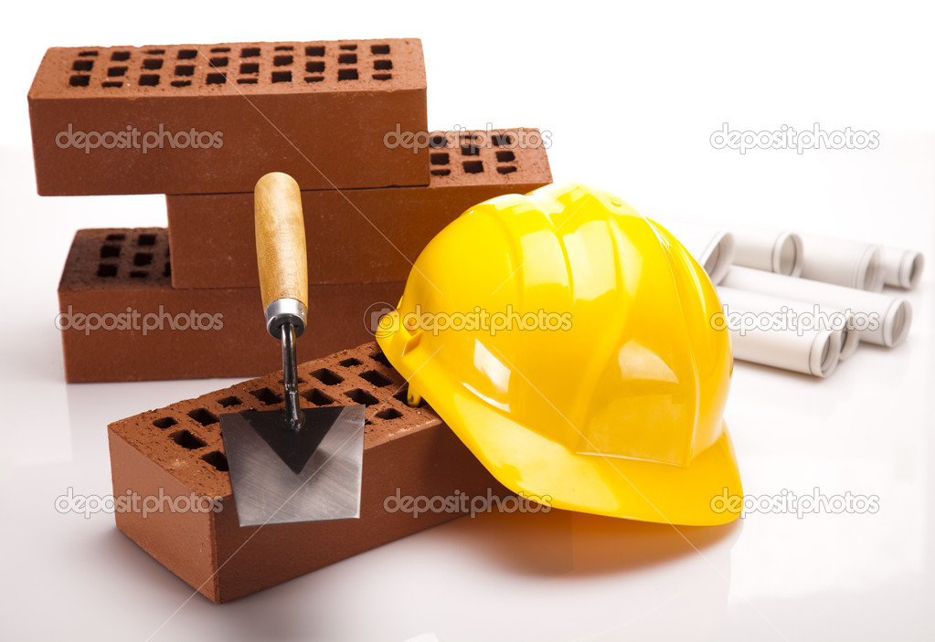 Brick, trowel tool and Construction plans