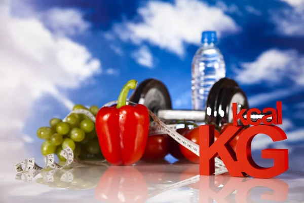 Kost og fitness, håndvægt i vitaminer - Stock-foto