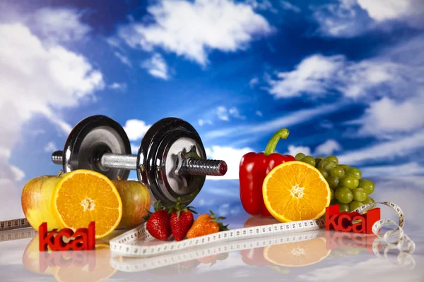 Dumbell and vitamins, blue sky — Stock Photo, Image