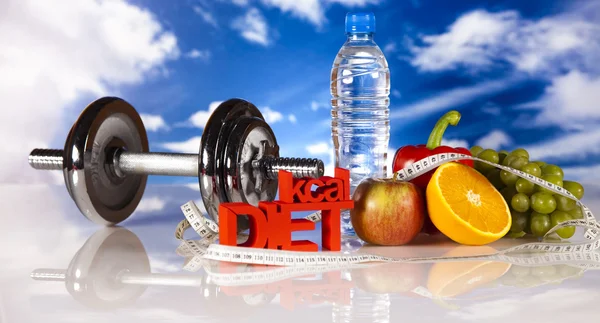 Dumbell and vitamins, blue sky — Stock Photo, Image