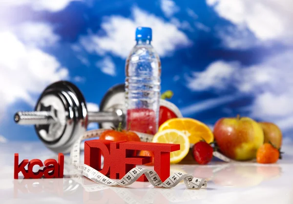 Dumbell and vitamins, blue sky — Stock Photo, Image