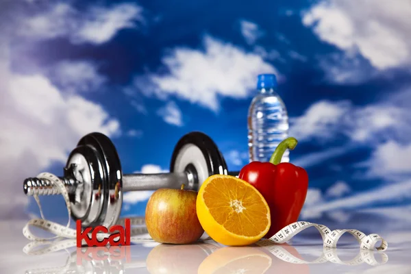 Dumbell and vitamins, blue sky — Stock Photo, Image