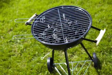 Grill on green grass