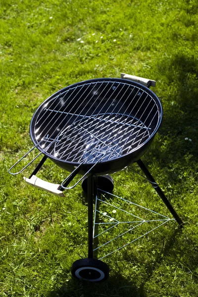 Grill on green grass — Stock Photo, Image