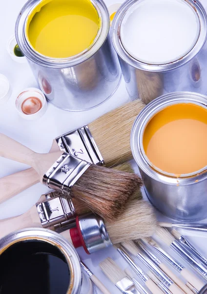 Cans and paint and brushes — Stock Photo, Image