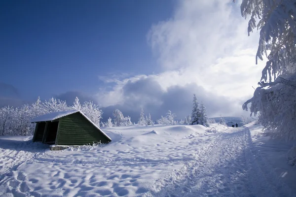 Wooden house on winter landscape — Stock Photo, Image