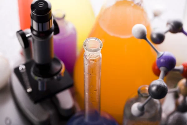 Microscope and atom & Laboratory glass — Stock Photo, Image