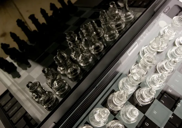 Glass chess with laptop — Stock Photo, Image