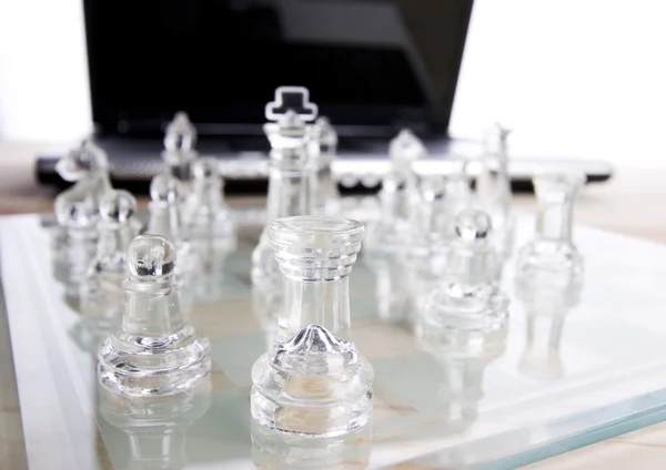 Glass chess with laptop — Stock Photo, Image