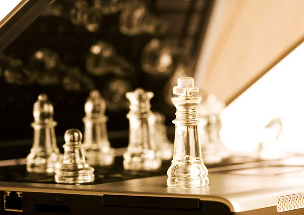 Glass chess with laptop — Stock Photo, Image