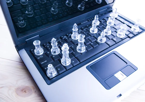Glass chess with laptop — Stock Photo, Image