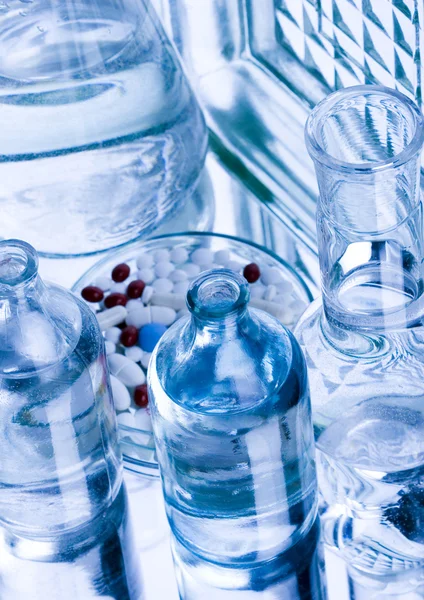 Laboratory glassware with drugs — Stock Photo, Image