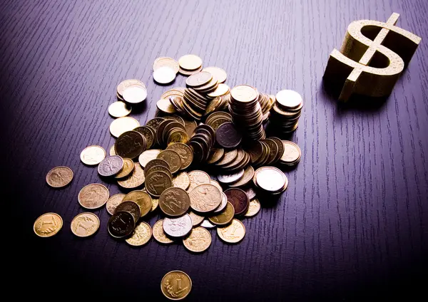 Money sign & coins — Stock Photo, Image