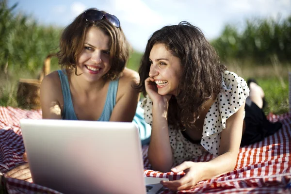 Girlfriends with laptop — Stock Photo, Image