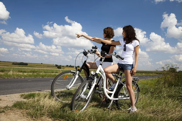 Girl with a bicycle enjoying — Stock Photo, Image