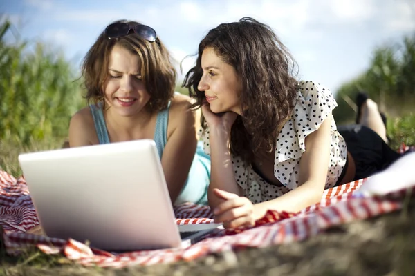 Girlfriends with laptop — Stock Photo, Image