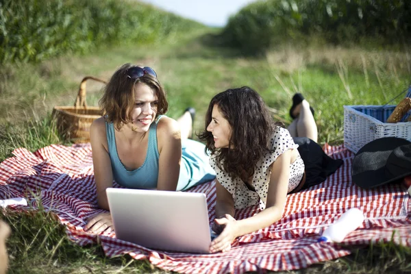 Girlfriends with laptop — Stock Photo, Image