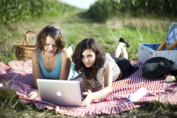 Girlfriends with laptop — Stock Photo, Image
