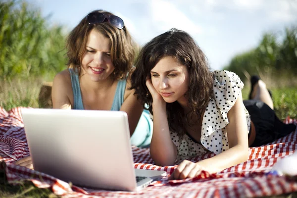 Girlfriends with laptop — Stock Photo, Image