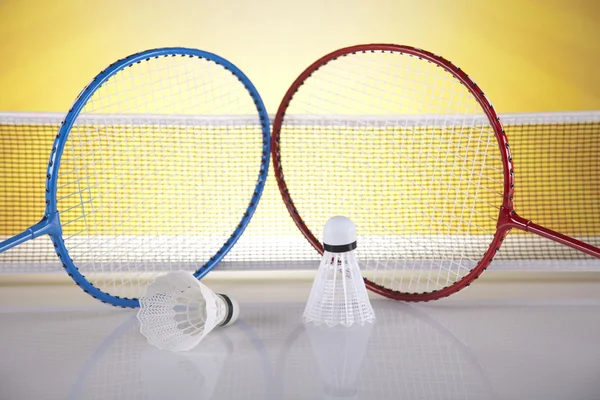 Shuttlecock on badminton racket — Stock Photo, Image