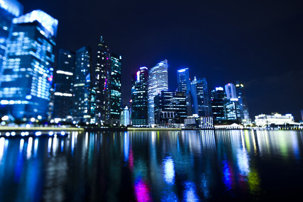 Singapore business district with waterfront at night