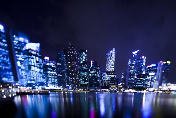 Singapore business district with waterfront at night