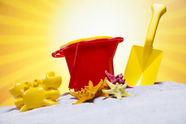 Plastic toys on the beach — Stock Photo, Image