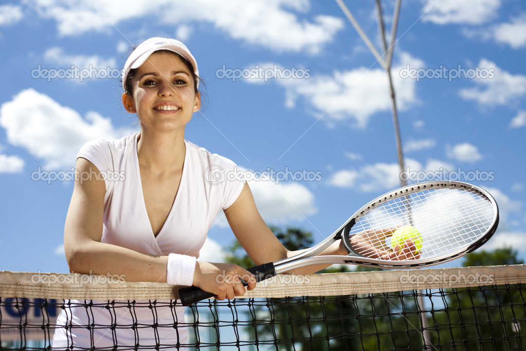 Girl rests on a tennis net