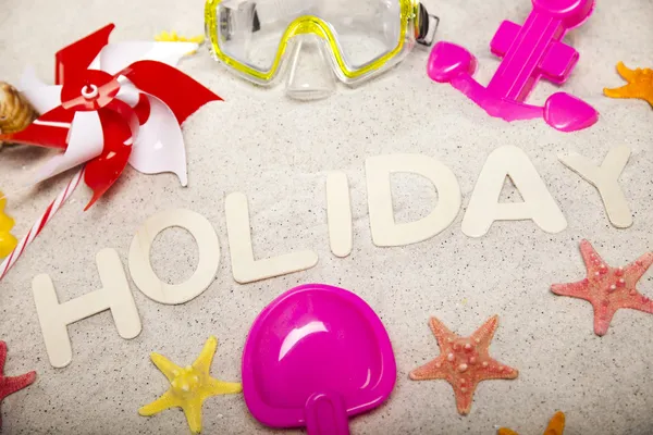 Holiday sign around toys — Stock Photo, Image
