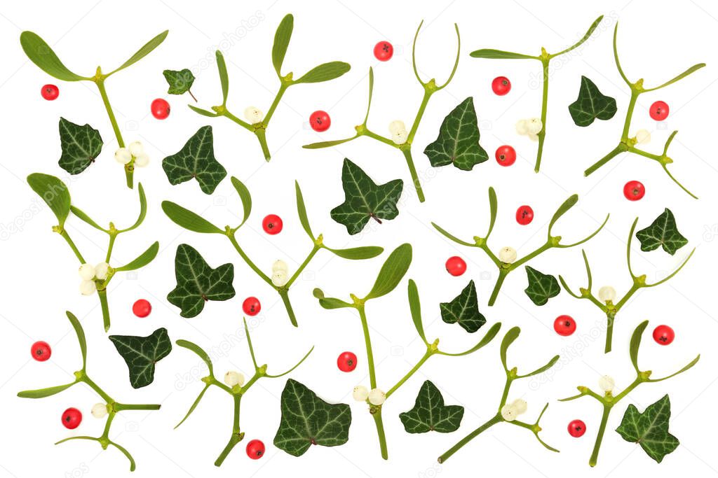 Mistletoe, ivy and holly berry abstract background pattern on white. English nature winter greenery worshipped by Druids as pagan symbols.  Solstice, Christmas, New Year composition. 