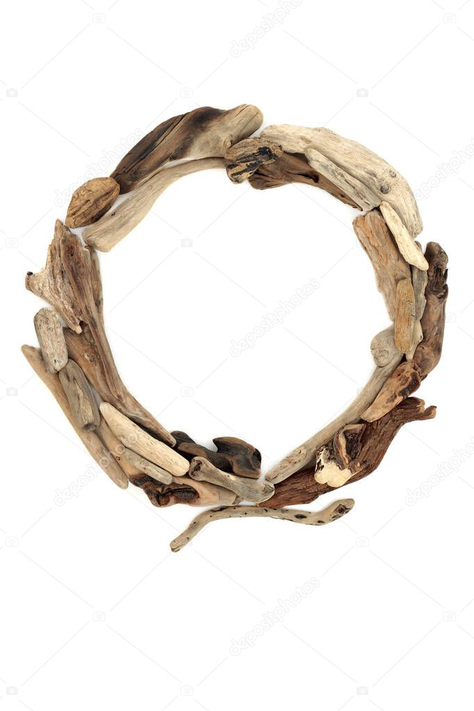 Natural driftwood abstract wooden picture frame composition. Round  shaped seaside art design element. On white background copy space, top view, flat lay