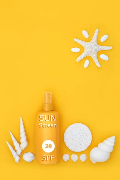 Suntan sunscreen lotion UV factor 30 bottle for skincare protection on yellow background with cosmetic sponge, abstract starfish sun and seashells.
