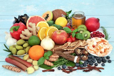 Immune system boosting health food with seafood, vegetables, fruit, honey, herbs, spice. Large collection high in antioxidants, anthocyanins, protein, fibre, vitamins, minerals, lycopene, omega 3.  clipart