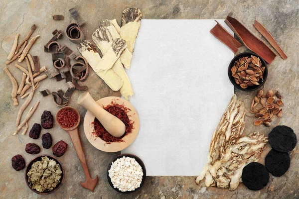 Chinese herbs and spice for alternative plant based herbal medicine health care with rice paper copy space for prescription text. Natural plant based herbal medicine health care concept.