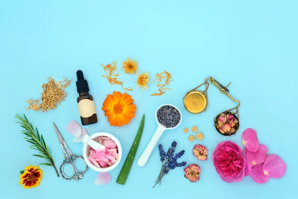 Flowers and Herbs for natural plant based aromatherapy skincare essential oil. Can ease psoriasis, eczema, acne and wounds. Natural summer floral beauty health care on blue background.
