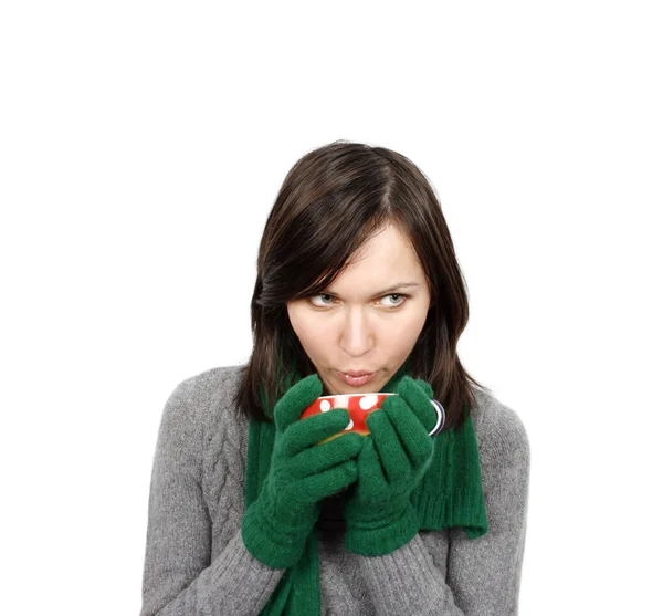 Woman drinking a hot beverage — Stock Photo, Image