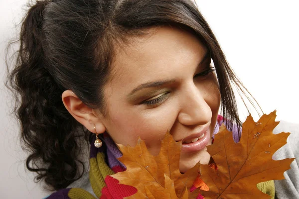 Beautiful woman with a leaf — Stock Photo, Image