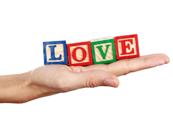 Liefde woord in een hand — Stockfoto